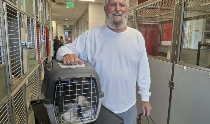 Mike picking Buster up after FIP treatment